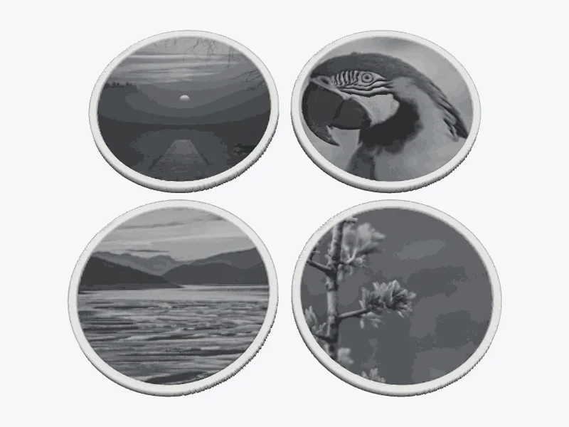 3D model of four round coasters with four different photos